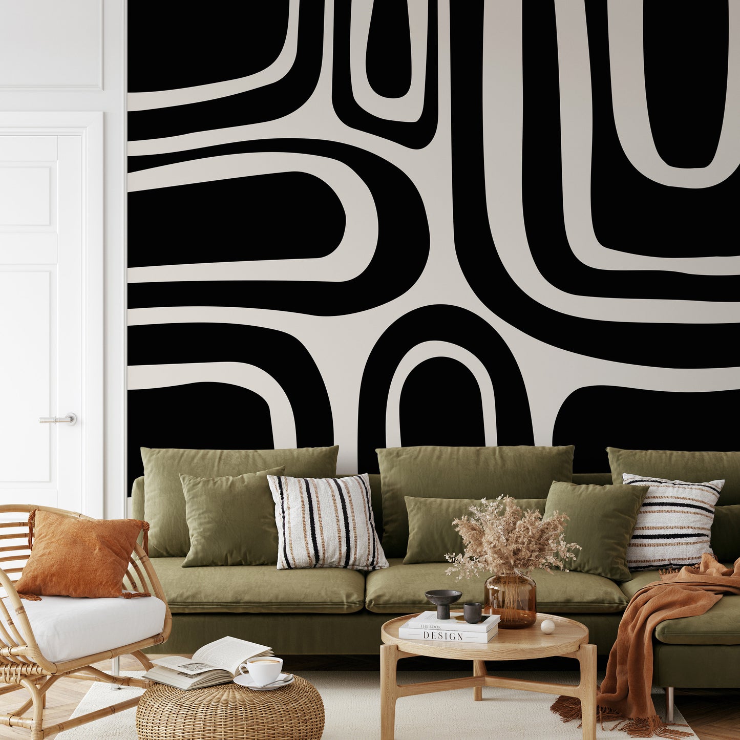 a living room filled with furniture and a large wall mural